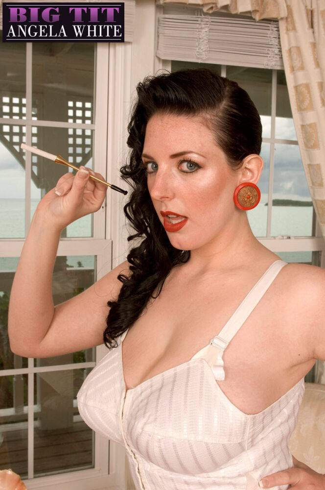 Solo model Angela White smokes from a cigarette holder in retro lingerie - #5