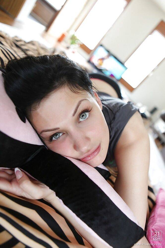 Pornstar with long legs Aletta Ocean is lying on her bed - #2