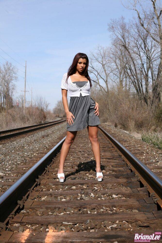 Amateur chick Briana Lee flashes her bare upskirt ass on train tracks | Photo: 820456