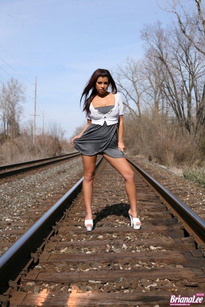 Amateur chick Briana Lee flashes her bare upskirt ass on train tracks | Photo: 820424