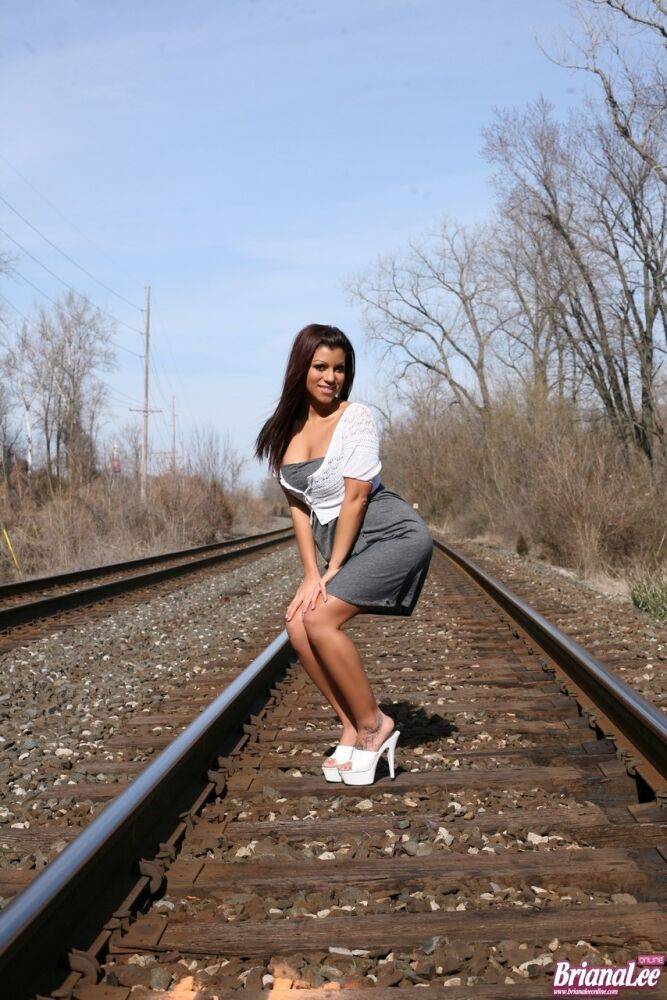 Amateur chick Briana Lee flashes her bare upskirt ass on train tracks | Photo: 820473