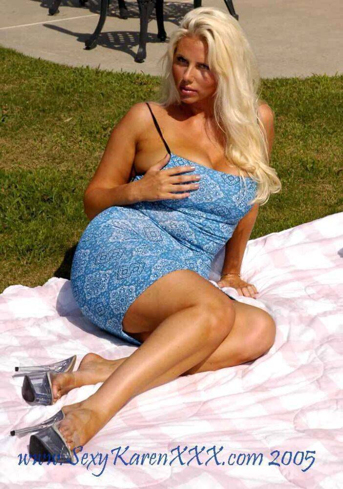 Busty blonde woman Karen Fisher cools her hot pussy with a cold bottle - #8