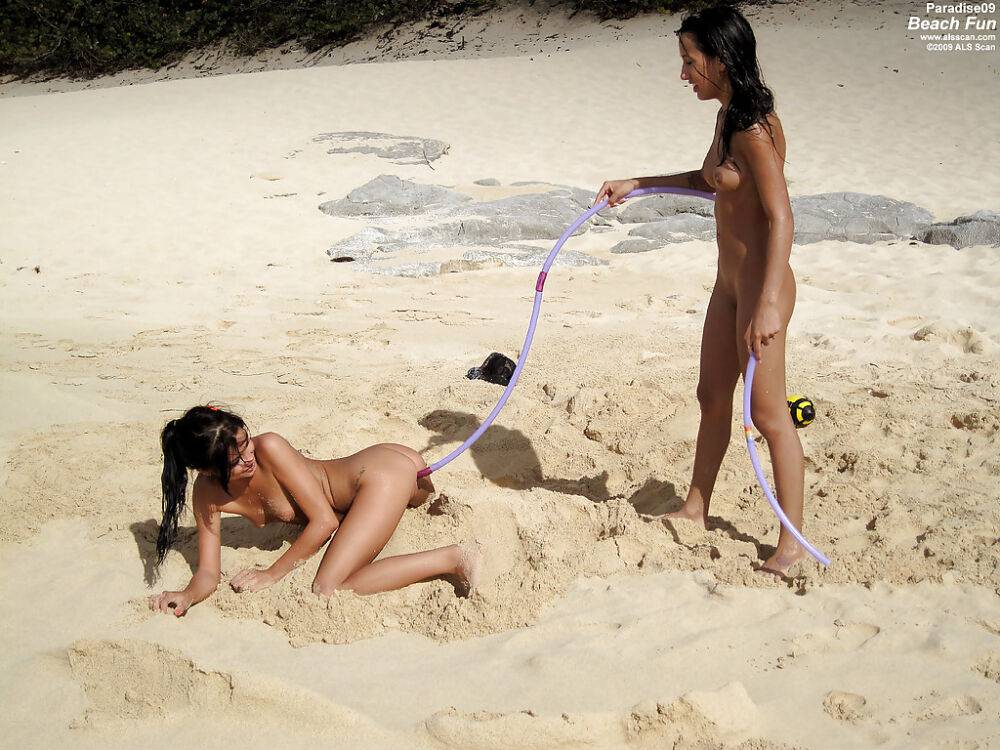 Seductive teenage lesbians stripping and caressing each other on the beach - #16