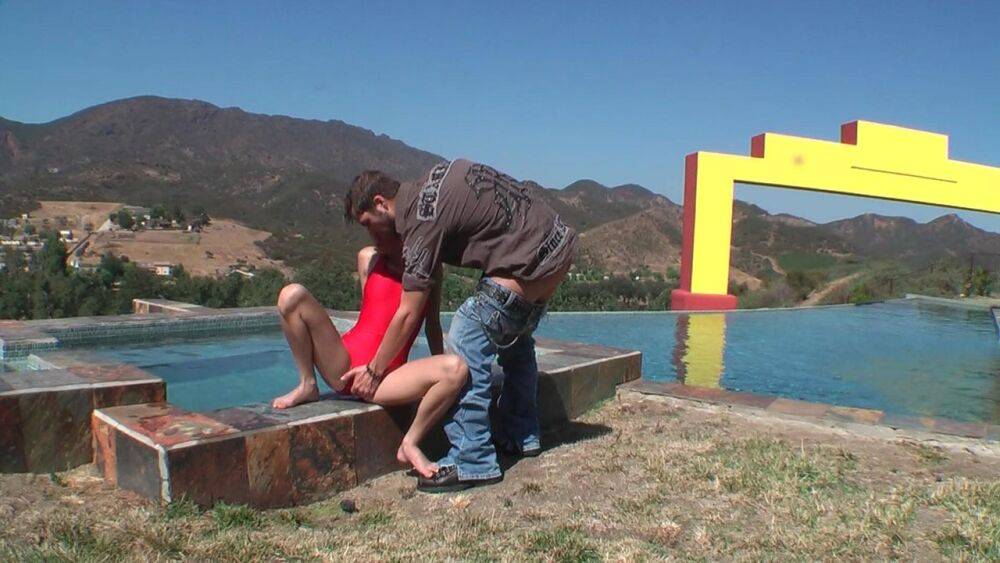 Young looking blonde Nicole Ray has sex on the side of a lakeside pool - #7