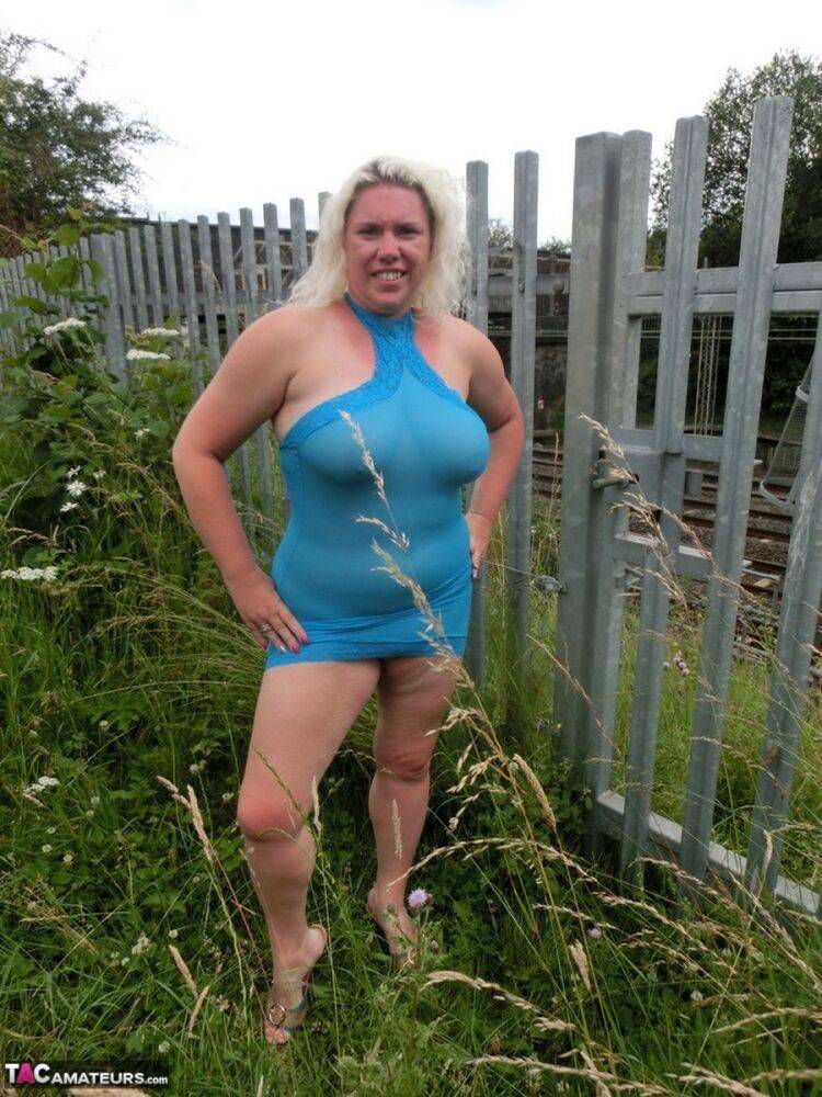 Mature blonde Barby shows her big tits and bald twat while changing clothing - #6