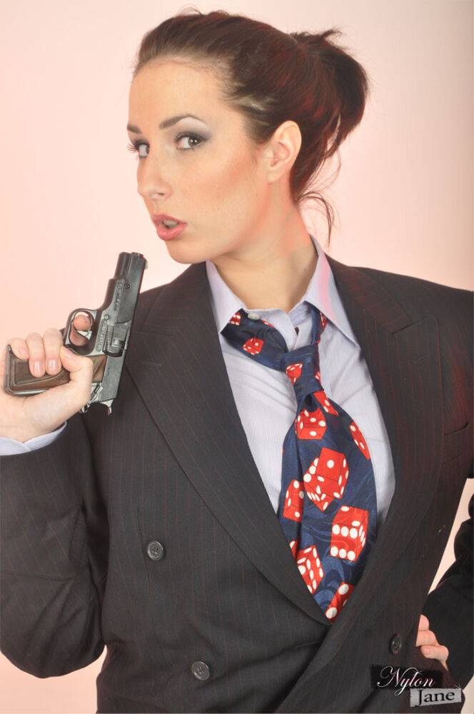 Clothed solo model Paige Turnah struts in a blazer while waving a pistol - #14