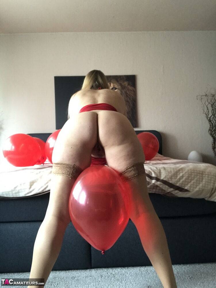 Middle-aged blonde Sweet Susi exposes her tits while playing with balloons - #3