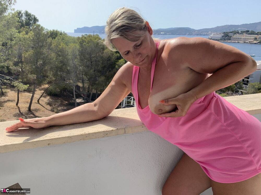 Thick older blonde twerks her big ass on a balcony after exposing herself - #6