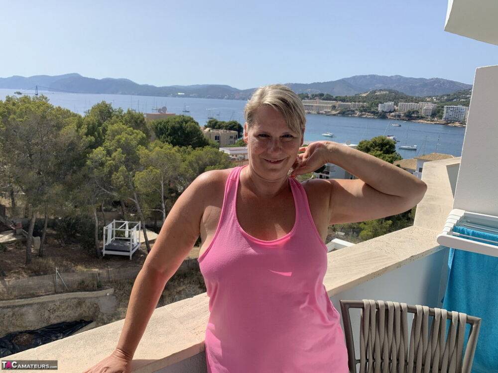 Thick older blonde twerks her big ass on a balcony after exposing herself - #16