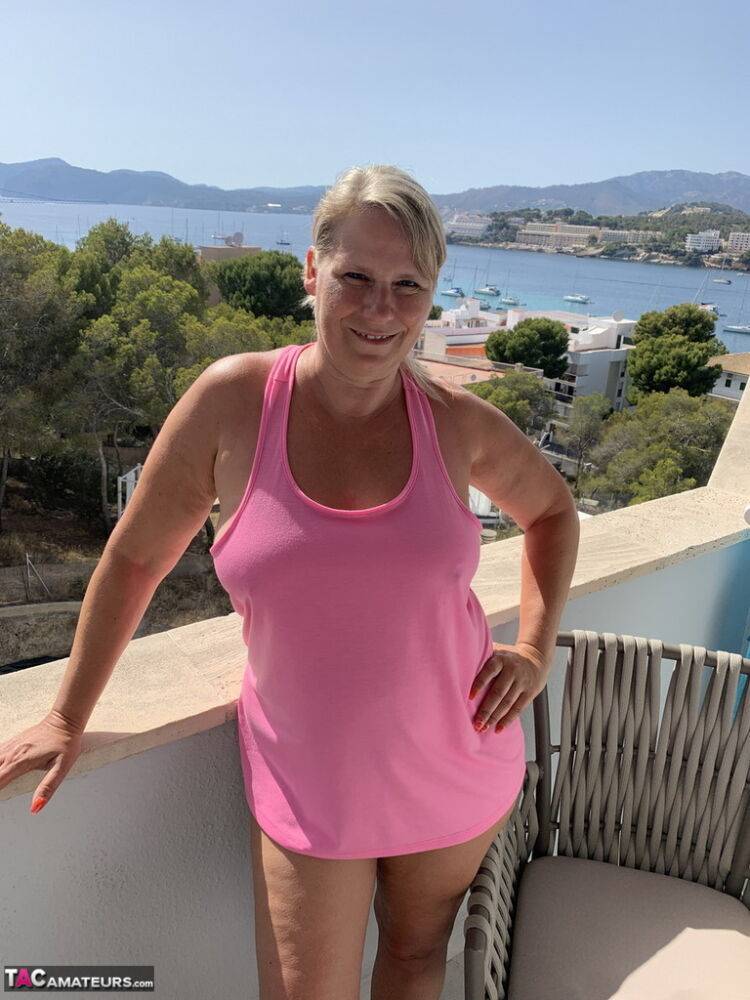Thick older blonde twerks her big ass on a balcony after exposing herself - #13