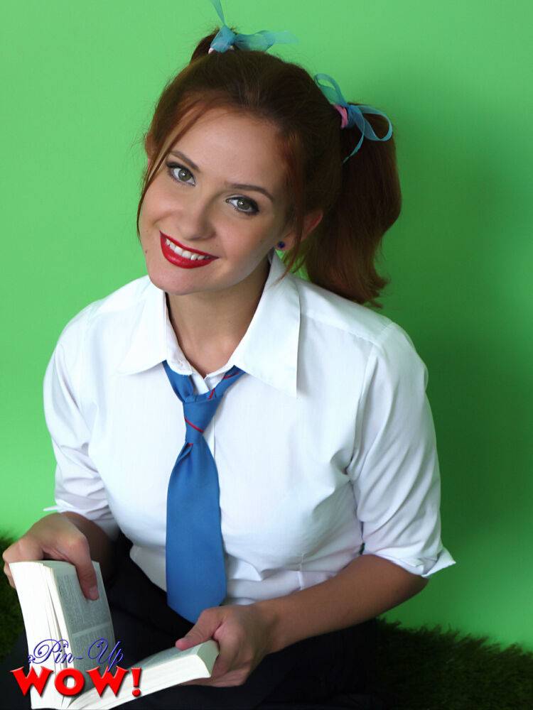 Cute redhead Elle Richie licks a lollipop before freeing big tits from uniform - #8