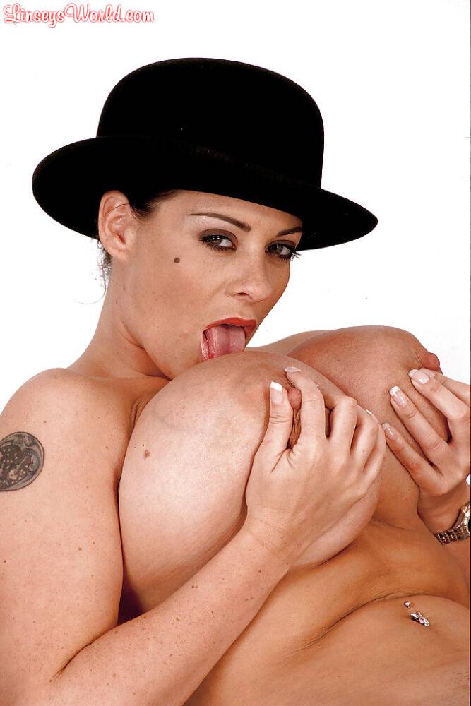 MILF solo girl Linsey Dawn McKenzie posing in hat while exposing huge juggs - #14