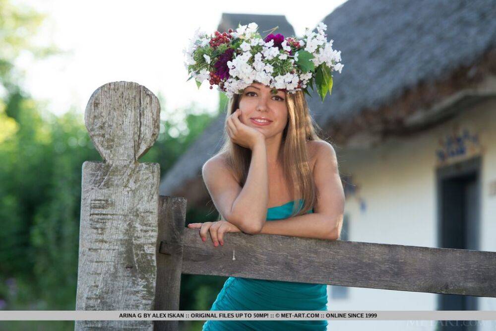 Young white girl wears a crown of flowers for nude poses in the country - #12