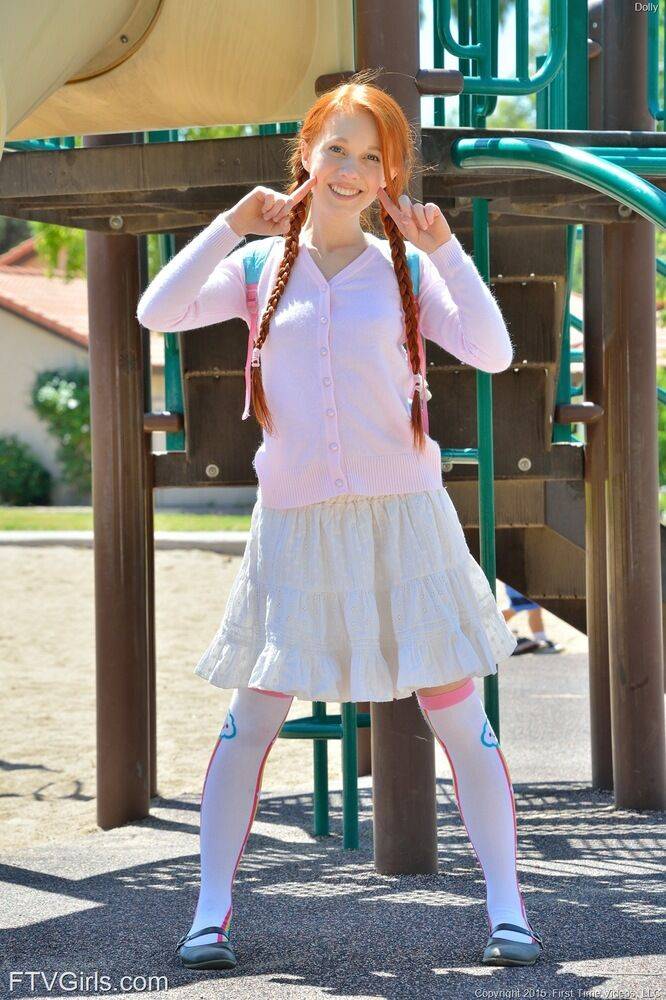 Young redhead in pigtails flashes pussy at the playground & toys in socks - #5