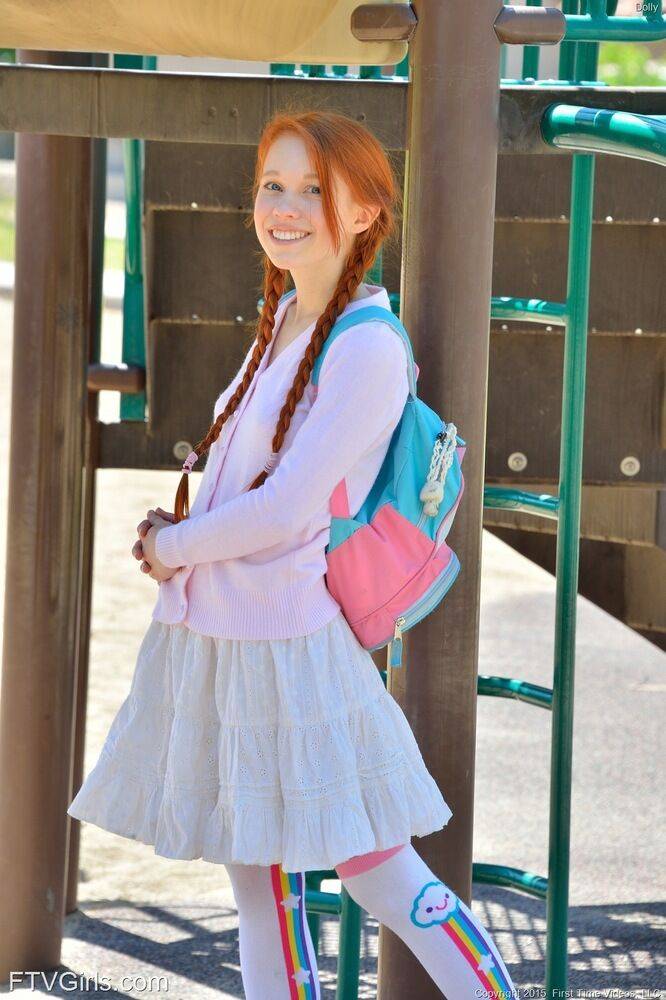 Young redhead in pigtails flashes pussy at the playground & toys in socks - #14