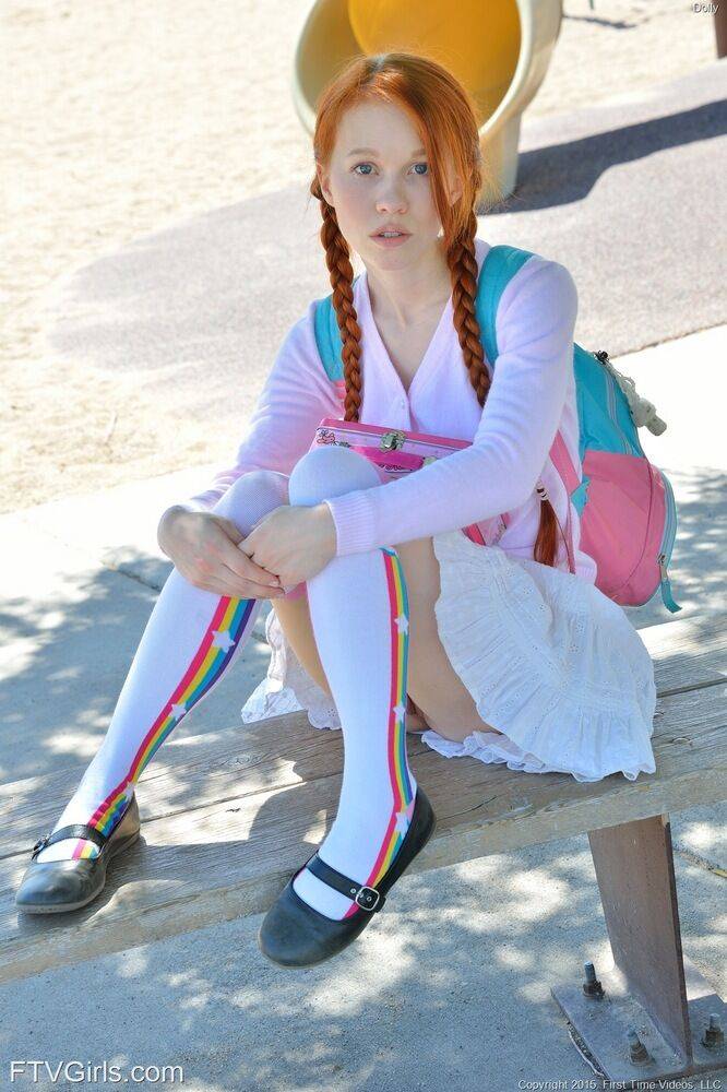 Young redhead in pigtails flashes pussy at the playground & toys in socks - #3