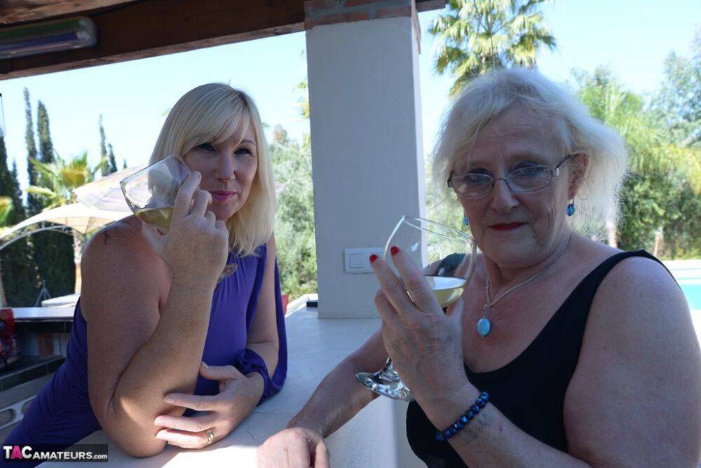 Old women share a lesbian kiss after drinking to much wine out on the patio - #7