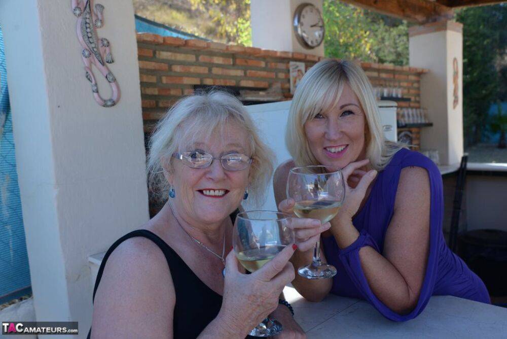 Old women share a lesbian kiss after drinking to much wine out on the patio - #8