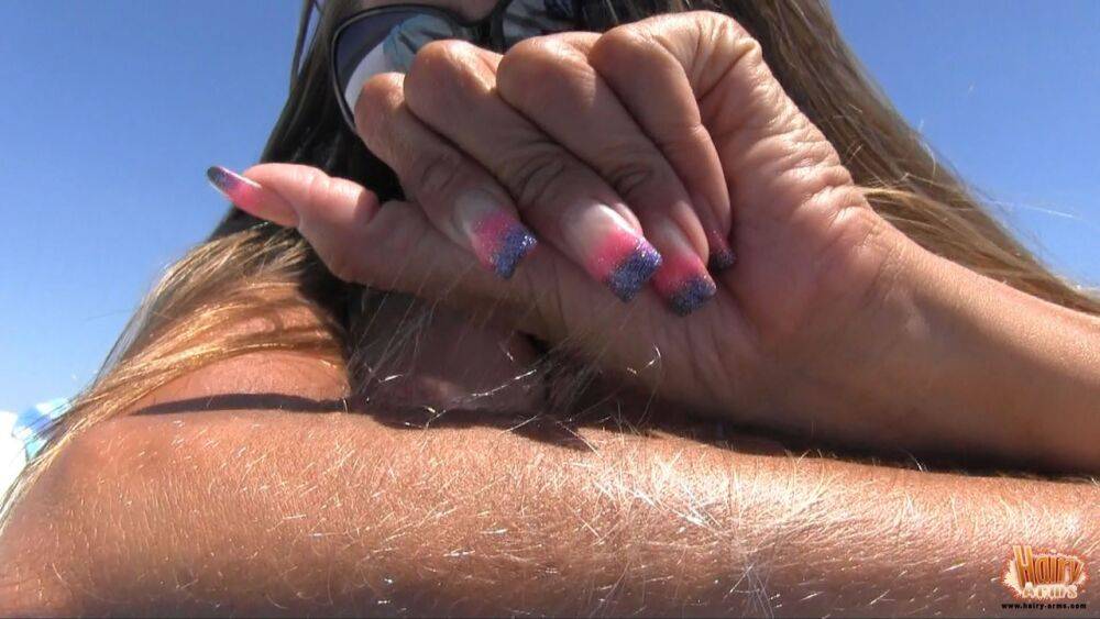 Amateur chick Lori Anderson tugs on her hairy arms in a bikini and shades - #9