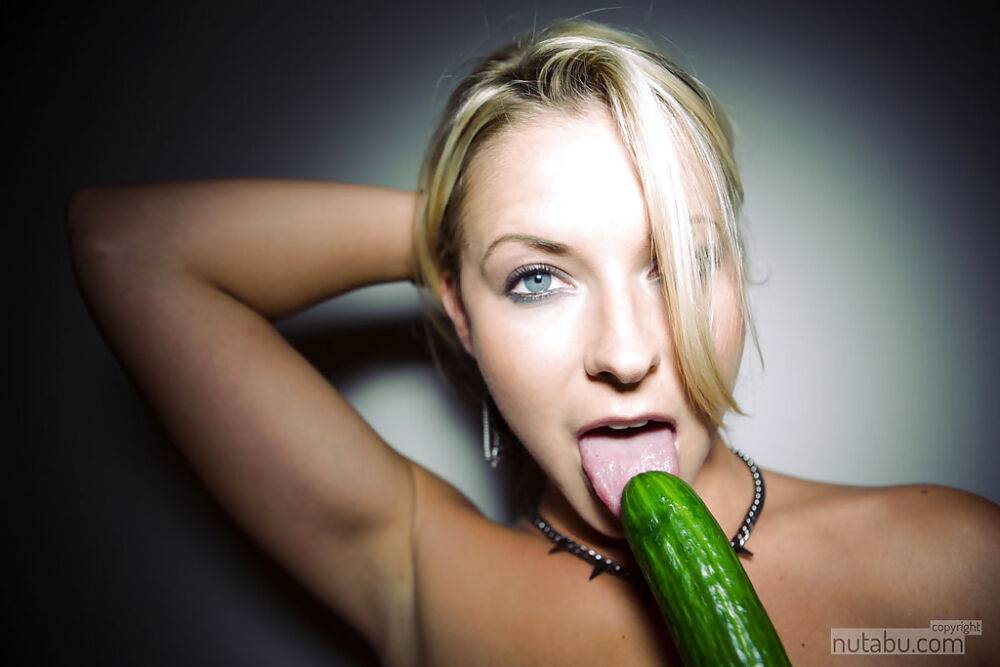 Blonde cutie toys her pleasing teenage pussy with large cucumber - #8