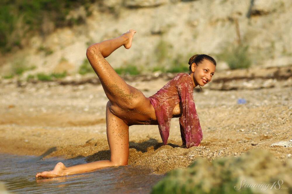 Young beauty Ambrosine M hits upon great poses in the water and on the beach - #15