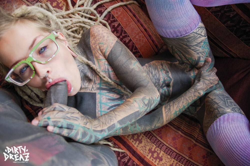 Heavily tattooed girl sucks on a black cock with her glasses on - #2