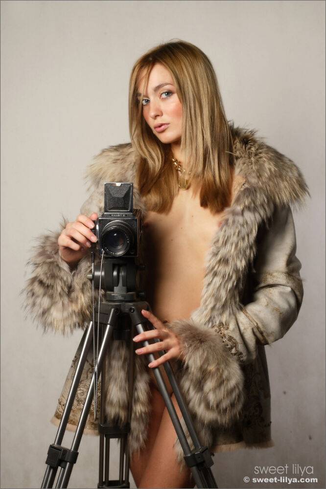 Blonde teen Sweet Lilya releases her slim figure from a fur trimmed coat - #6