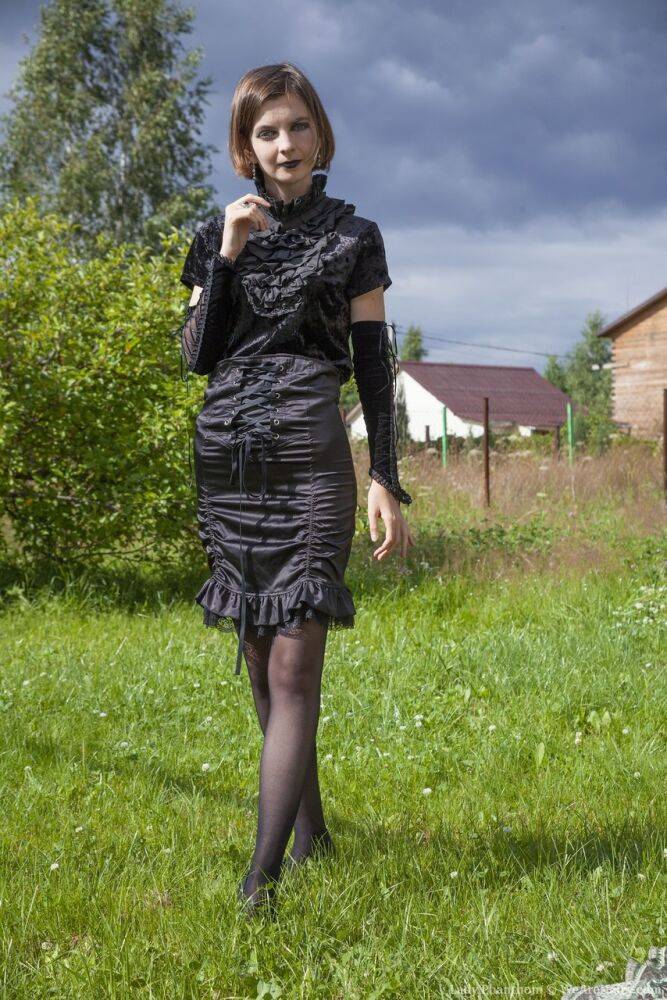 Skinny amateur Lady Phanthom doffs a dress and hose to pose nude in a yard - #16