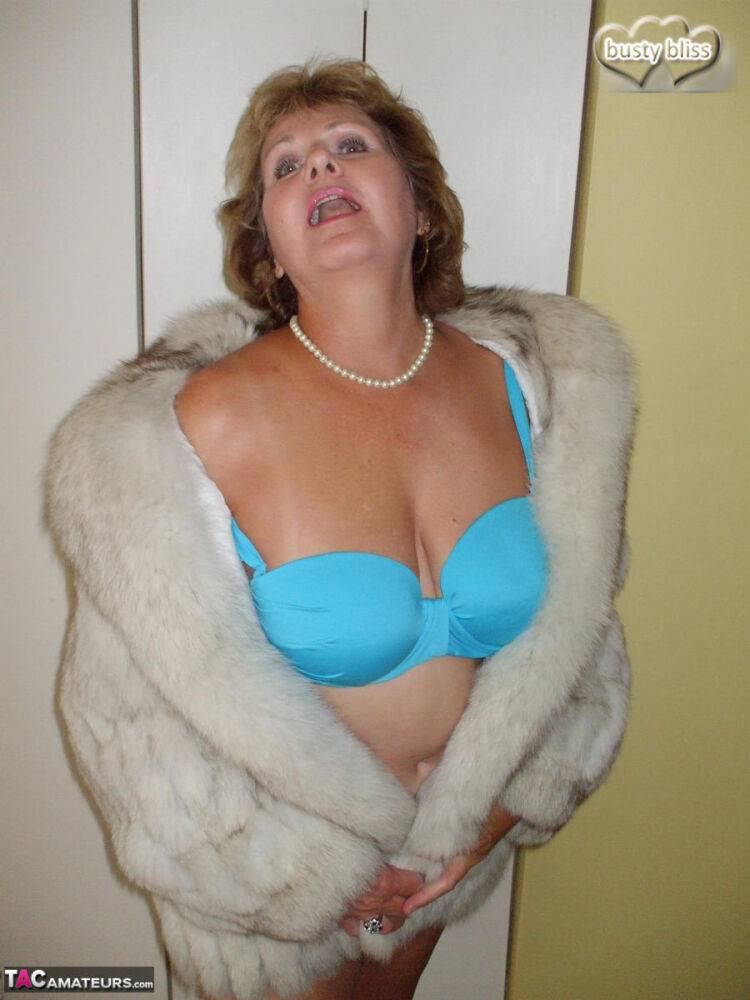 Chubby mature woman Busty Bliss releases her tan lined tits from a fur coat - #15