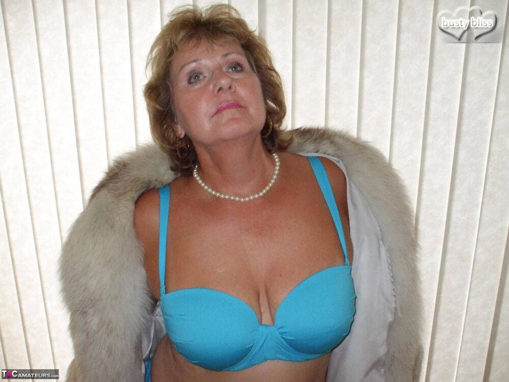 Chubby mature woman Busty Bliss releases her tan lined tits from a fur coat - #6