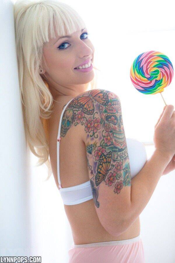 Tattooed blonde Lynn Pops strikes great poses with a lollipop in hand - #2