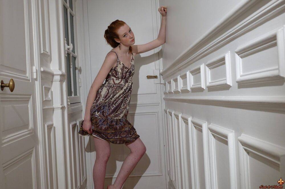 Pale redhead Nathalie Lawson exposes her upskirt underwear in a hallway - #4