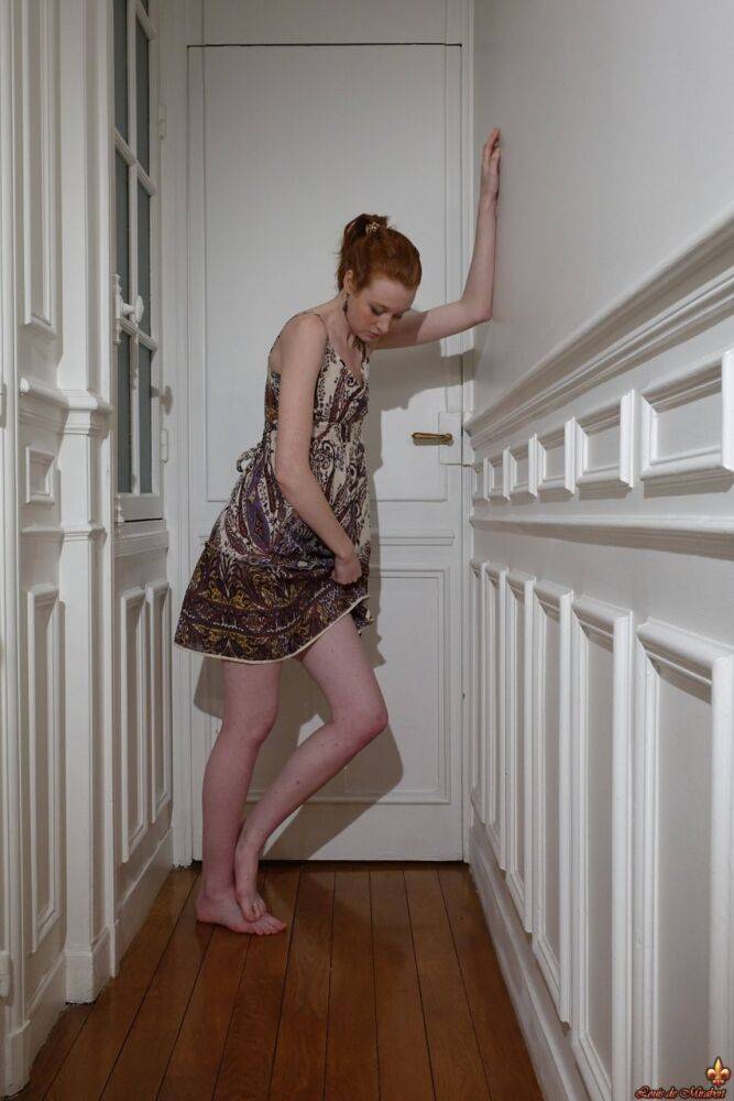 Pale redhead Nathalie Lawson exposes her upskirt underwear in a hallway - #9