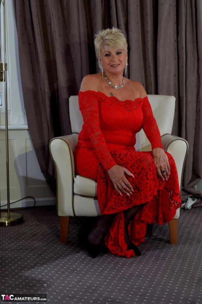 Older lady with short blonde hair Dimonty slips off a long red dress - #12