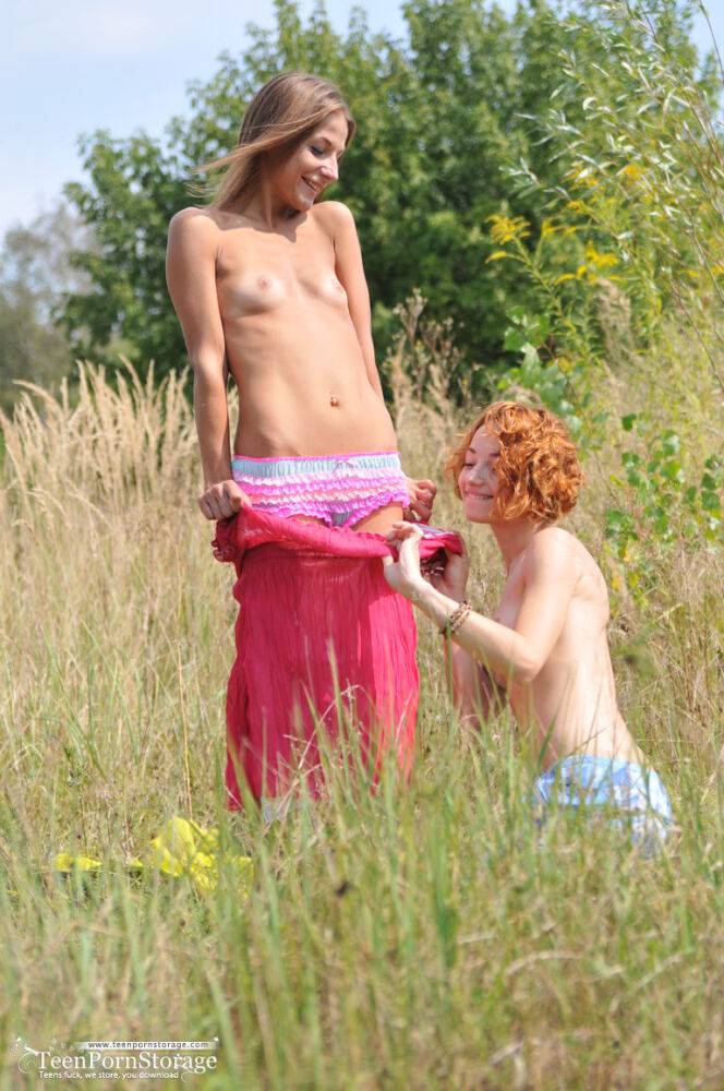 Young lesbians Nastya & Foxy gets naked on blanket in a field - #10