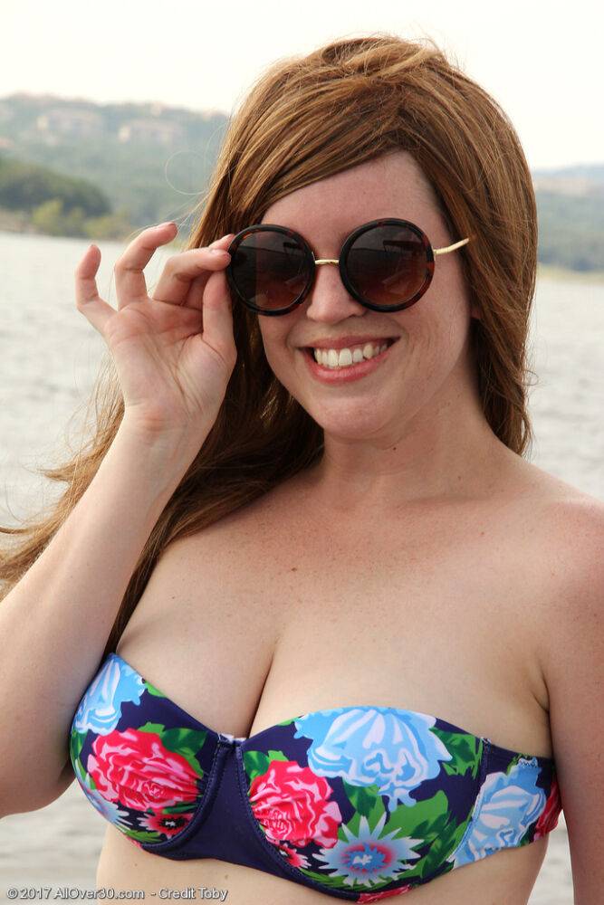 Chubby mature Holly Fuller doffs bikini to flaunt her big tits & ass on a boat - #1