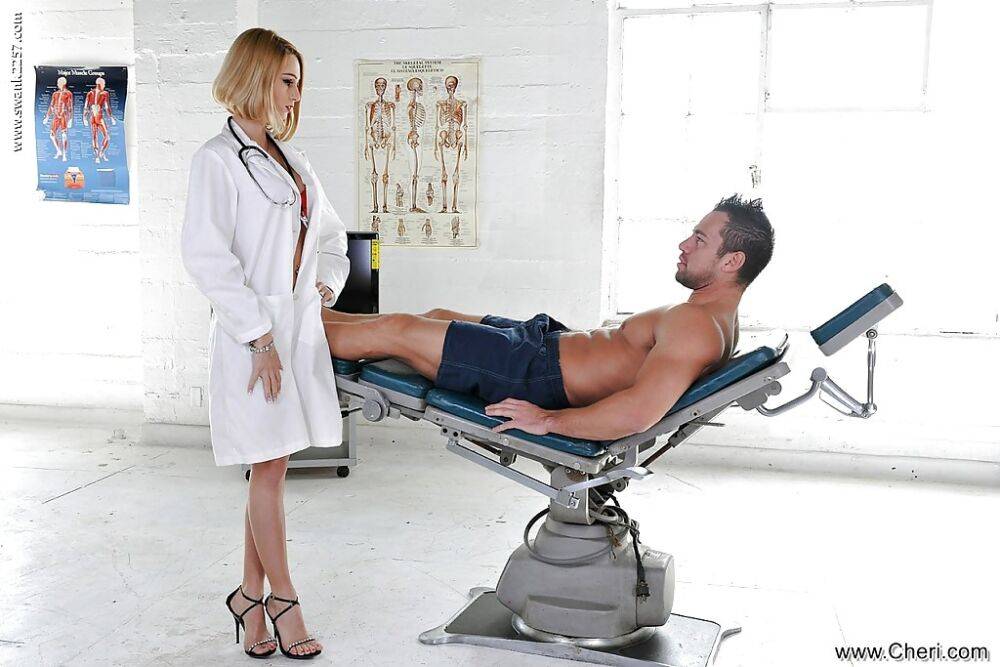 Blonde nurse Erica Foutos giving a muscular patient a blowjob | Photo: 2255251