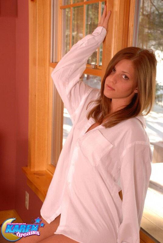 Young amateur Karen exposes her bare bum during a solo affair by a window - #12