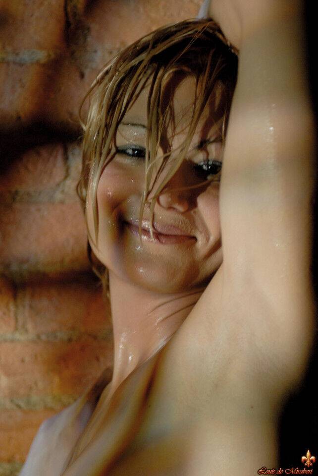 Glamour model gets soaking wet during a solo shoot afore a brick wall - #6