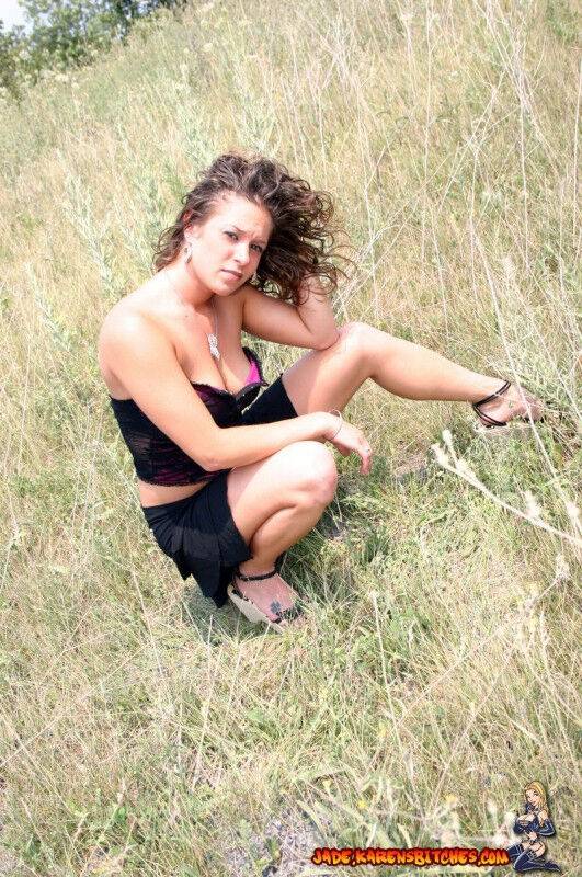 Teen amateur shows some cleavage during a SFW shoot out in a field - #12