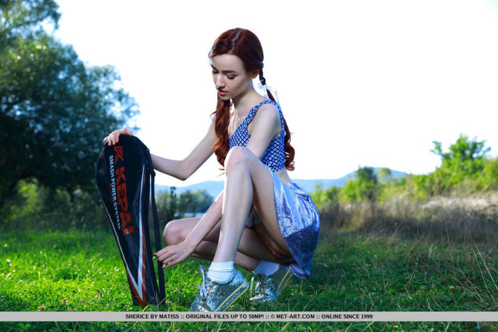 Young redhead Sherice pauses a badminton game to show her tight slit on grass - #3