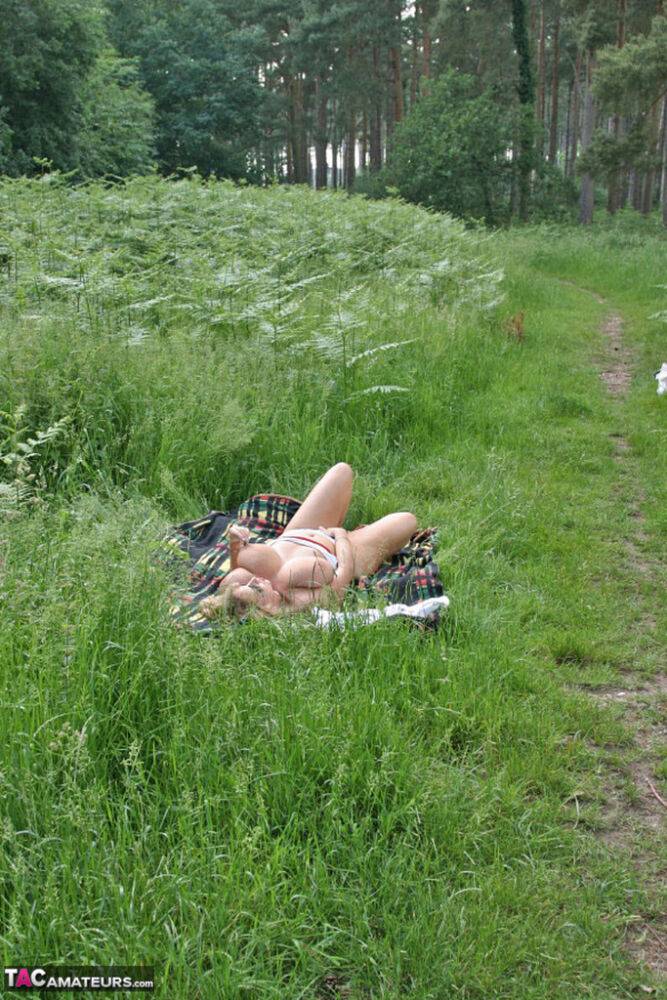 Big titted mature plumper Curvy Claire slides her panties aside in a field - #11