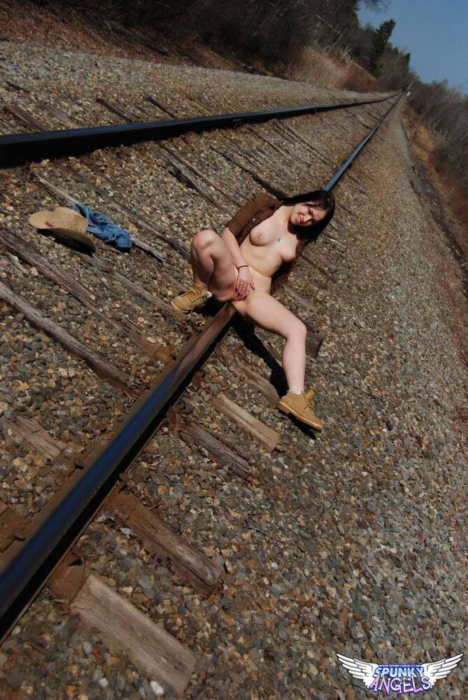 Young amateur Emily Love exposes herself on railway tracks in a hat and boots - #2