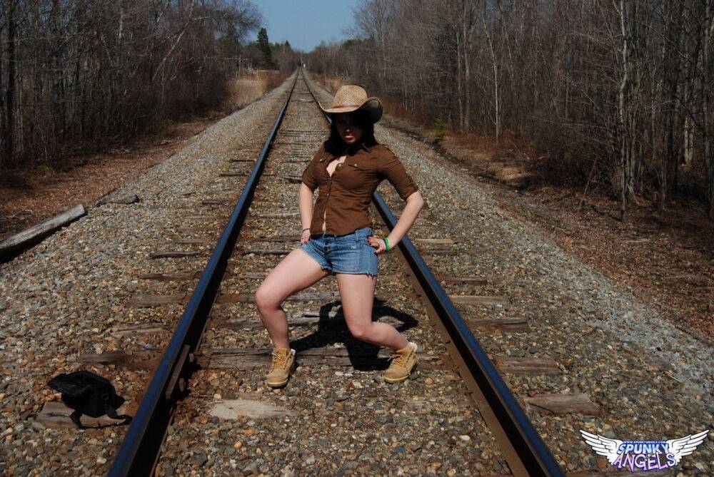 Young amateur Emily Love exposes herself on railway tracks in a hat and boots - #11