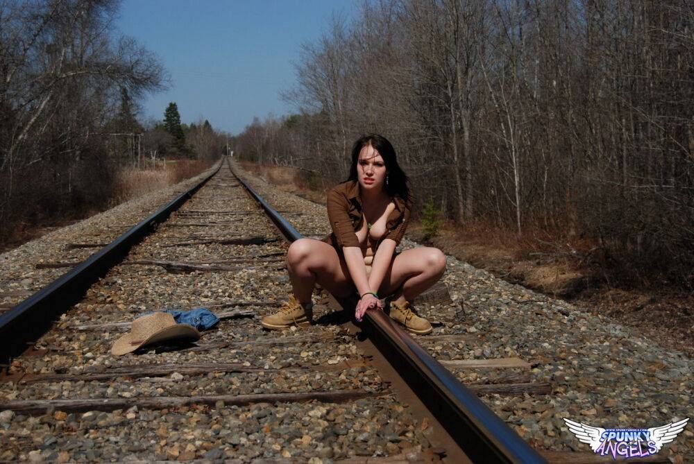 Young amateur Emily Love exposes herself on railway tracks in a hat and boots - #6