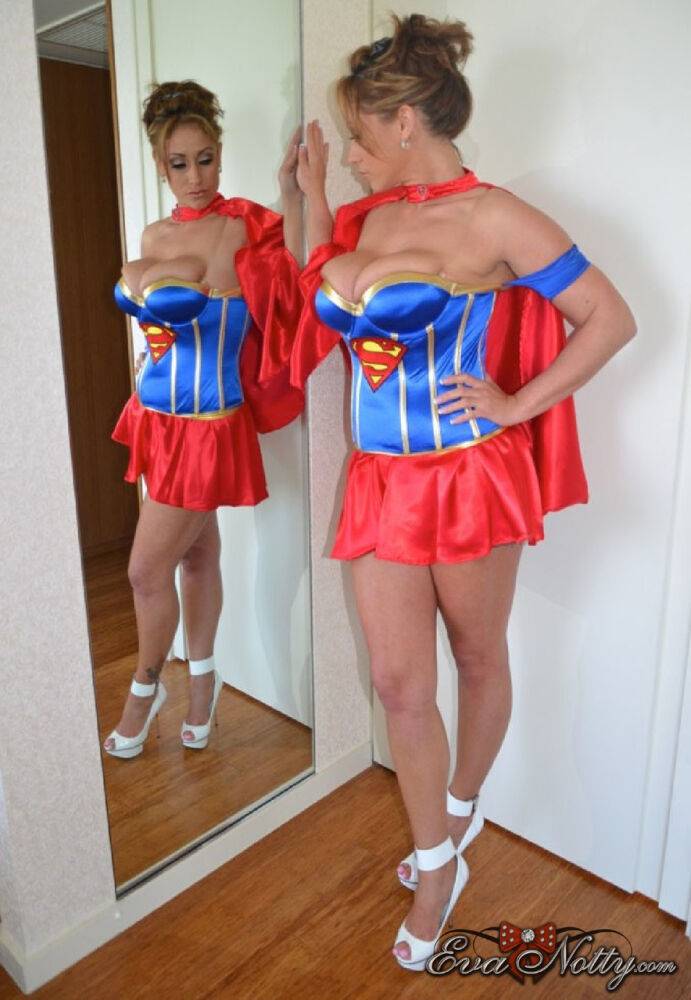 Sexy MILF Eva Notty sports cum on her tits while removing a Superman costume - #8