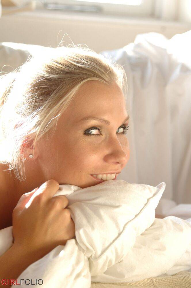 Blonde glamour model Michaela sets her from tits free of a lingerie on a couch - #3