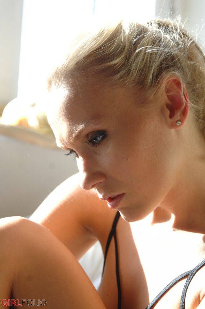Blonde glamour model Michaela sets her from tits free of a lingerie on a couch - #9