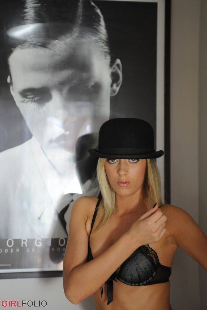 Saucy blonde Charlotte strips to a bowler hat and heels in a bathroom - #7