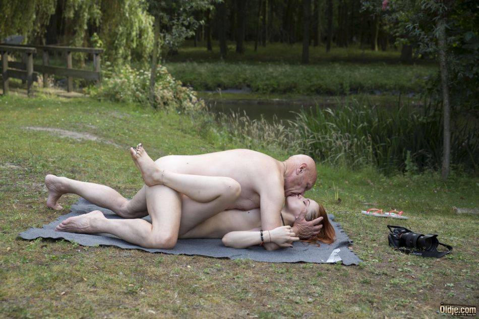 Young redhead Red Linx and her old lover fuck on a blanket in a nature park - #1